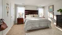 A king size bed fits easily in the Master bedroom, with two closets for all your storage needs.