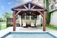 Enjoy lazy summer days under your very own private pool side cabana! 