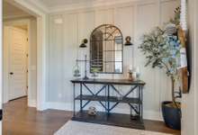 Custom trim work lends itself beautifully to this inviting foyer