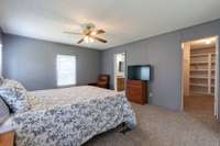 The primary bedroom features a ceiling fan, extra large closet and carpet flooring! 391 Hilltop Lane Woodbury, TN 37190