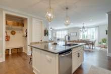 This kitchen is not only highly functional but is also visually pleasing as the centerpiece of the main level of this home