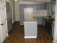 Kitchen from dining room. Pantry door to front left