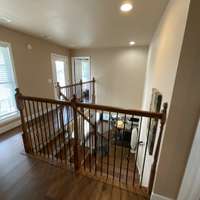 First door on the right leads to the balcony across the full width of the front of the house. The door beside it leads to the main bedroom offering privacy from the other bedrooms on the other side of the stairway.