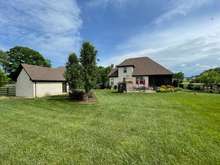 Back View of Home with 1-Car Detached Garage.