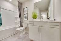 Full bath upstairs with double vanities  *Photo of decorated model