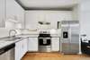 Beautiful hardwood floors in the kitchen and living space.