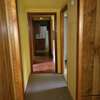 Looking through hallway from master bed to kitchen.