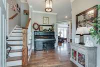 Entry Foyer showing the homes beautiful hardwood floors and extensive trim work