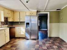 Eat In Kitchen with stainless refrigerator