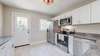 Lots of natural light with new back door and light tile colored flooring