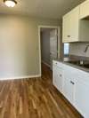 Another view of the kitchen. Door across the room leads to the bedroom.