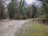 This is the neighbors driveway that actually is on a small portion of the north-western corner. The road to the left is the continuation of Old Road Lane that enters into the upper tract.