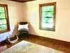 Secondary bedroom with wood floors, Bead-board ceiling & walk in closet. 