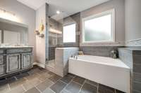 Beautiful primary bathroom suite with separate tiled shower and soaking tub!