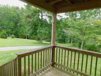 Lush Green Treed views from the front porch in all directions - A Rare find with such affordability and possibilities to improve the entire acreage- Internet available through NCTC Westmoreland