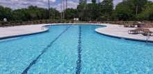 Swim lane and bench seating inside along the pool's edge.