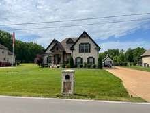 Front View of Home with Matching Brick/Stone Mailbox.