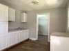 Kitchen w/ new cabinets and counter tops New LVT flooring