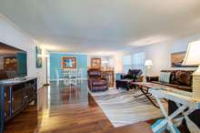 Large Den, Dining Room, Breakfast nook area with laminate flooring throughout this space and hallway.  