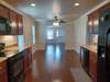 View from kitchen into the dining and living spaces.