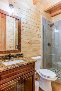 Bathroom 3, downstairs, far left, under stairs