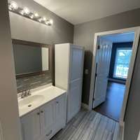 Bathroom opens to third bedroom.