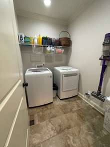 Laundry Room with Beautiful Ceramic Tile Flooring.