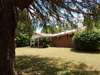 Right side of home with plenty of shade trees.