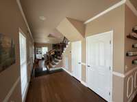 Behind the doors in the hallway is a double-deep coat closet and a broom closet.