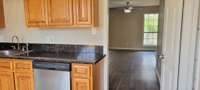 Granite Tiled Countertops! Fresh paint throughout Home! Laminate Flooring throughout Home!