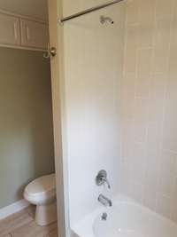 Tile surround and tile floor.