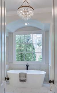 There is a gorgeous soaking tub, steam shower, double vanities and great natural light in this bathroom!