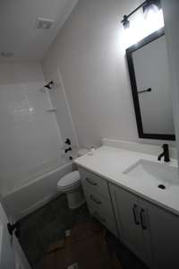 Second bathroom on main level Tile floor and tile surround on tub!