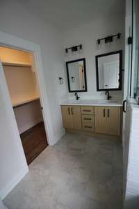 Master bathroom with double vanity and walk in closet with built-ins!