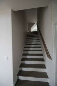 Stairs that lead to large bonus room above the garage! Can be used as office, movie room etc!