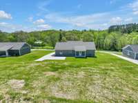 37 Trousdale Ferry Pike, Gordonsville TN  Hardie Board exterior, upgraded roof shingles, vinyl maintenance free trim, concrete driveway with rear turnaround & covered back porch.