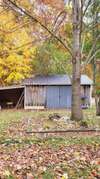 13x20 insulated storage building, with attached 9x12 open shed.