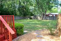 Large, level, fenced-in backyard is perfect for kids and pets.