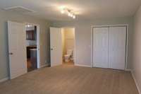 Primary Bedroom/ Rec room has half bath. Washer/Dryer hook-ups in closet as well. 