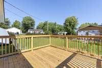 The new, large wooden deck with wooden railing looks out over the back yard! Ideal for grilling & enjoying the outdoors in the comfort of your home! 518 Miller Road Smithville, TN 37166