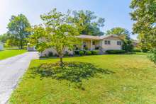 The large yard has beautiful trees. The home has new plumbing under the home as well as new vapor barrier! 