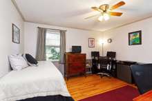 This is the primary bedroom located on the backside of the home with a renovated full bath. It is currently being used as a home office