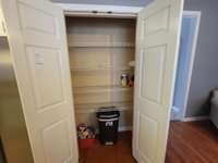 Separate pantry cabinet making it easy to organize and restock.