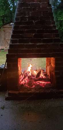 Outdoor brick fireplace in action