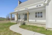 Main Front Porch leading to the Main Entrance of the Home.