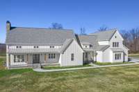 Front view of home. Notice the two entry points to the house off of the front exterior. There are 4 Covered Porches. And Crawlspace has been encapsulated.