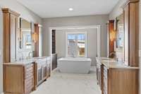 Master Bathroom with his/hers vanities. Bathroom also has a door to the laundry room