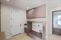 Built-in Cabinetry for Washer and Dryer w/additional storage above, and also sink to the left.