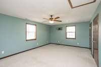 One of two upper level bedrooms is right off the bonus room.