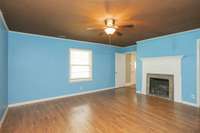 This room is approx. 15x15 with an ornamental fireplace